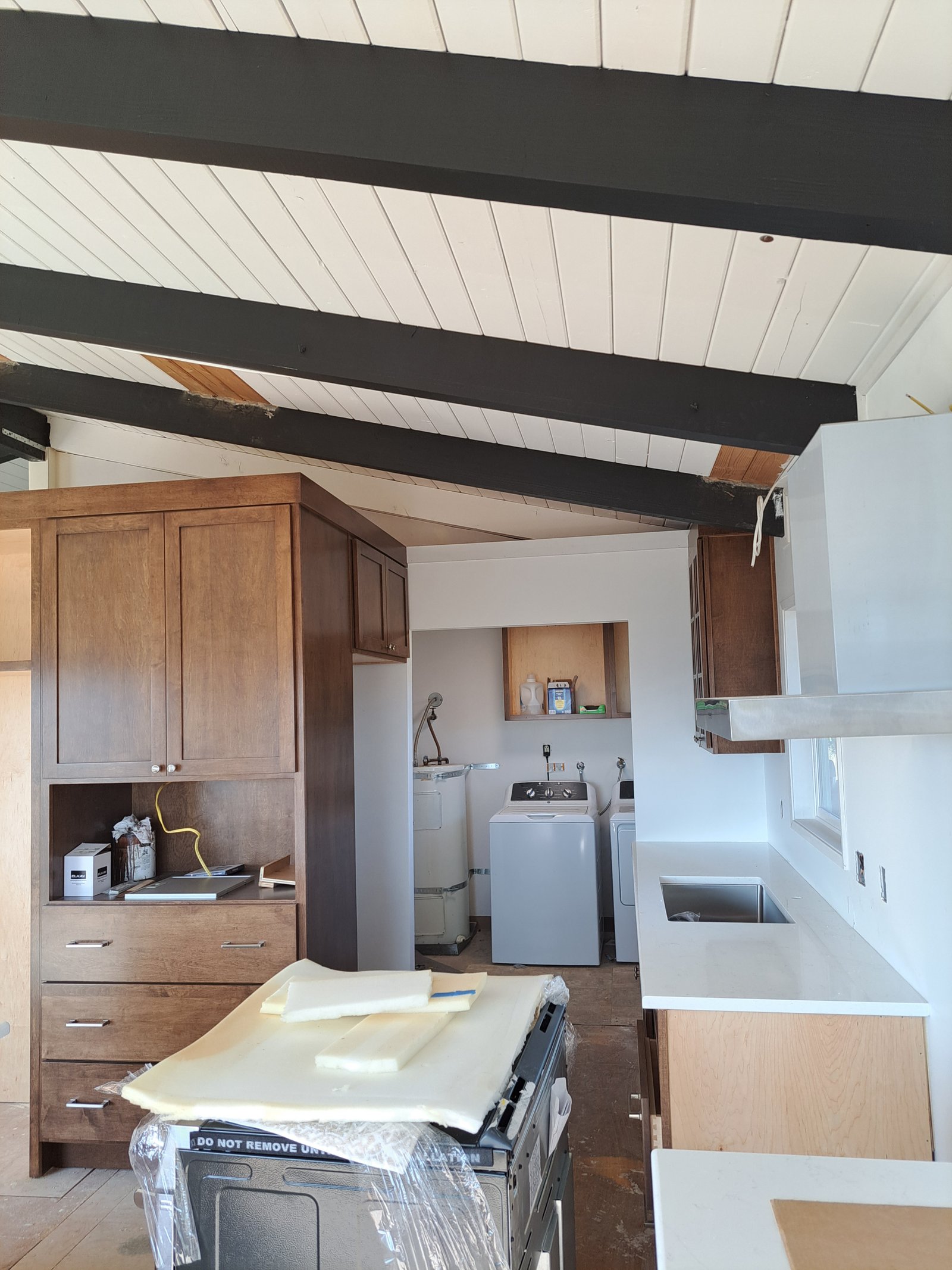 Finished maple kitchen with custom cabinetry and countertops