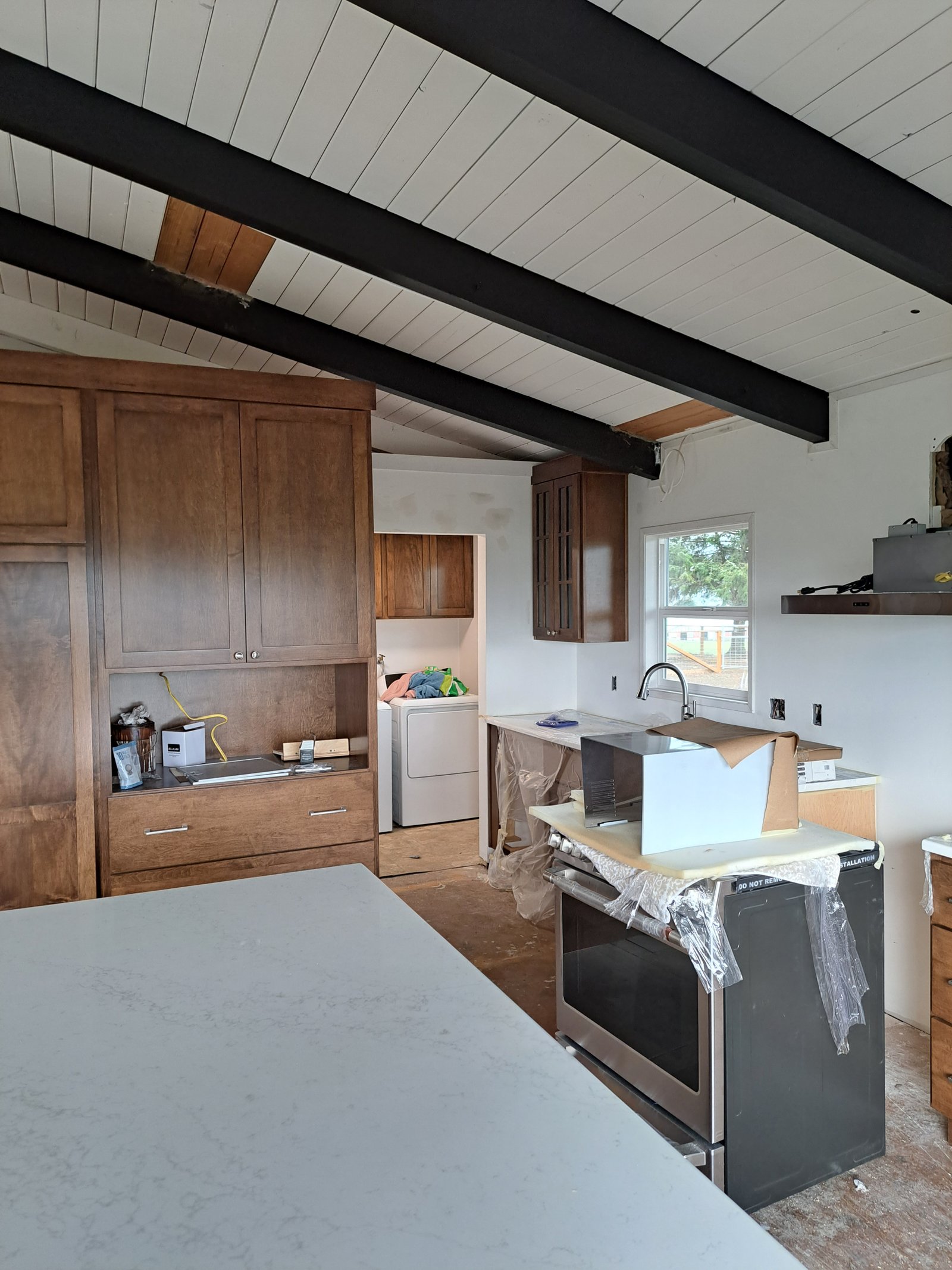 Full kitchen view with maple cabinets and appliances